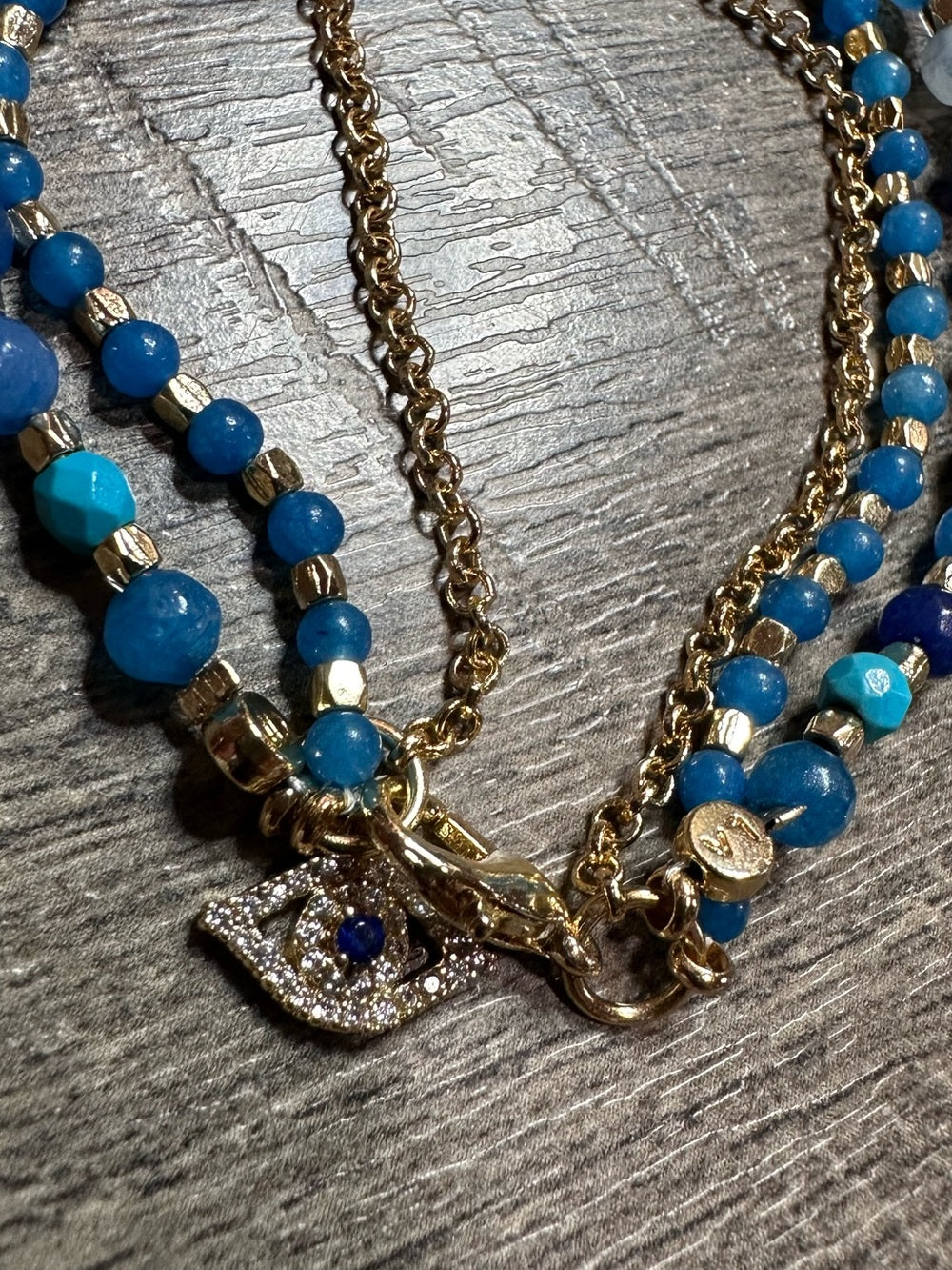 Unwritten Triple Strand Multibead Evil Eye Charm Bracelet